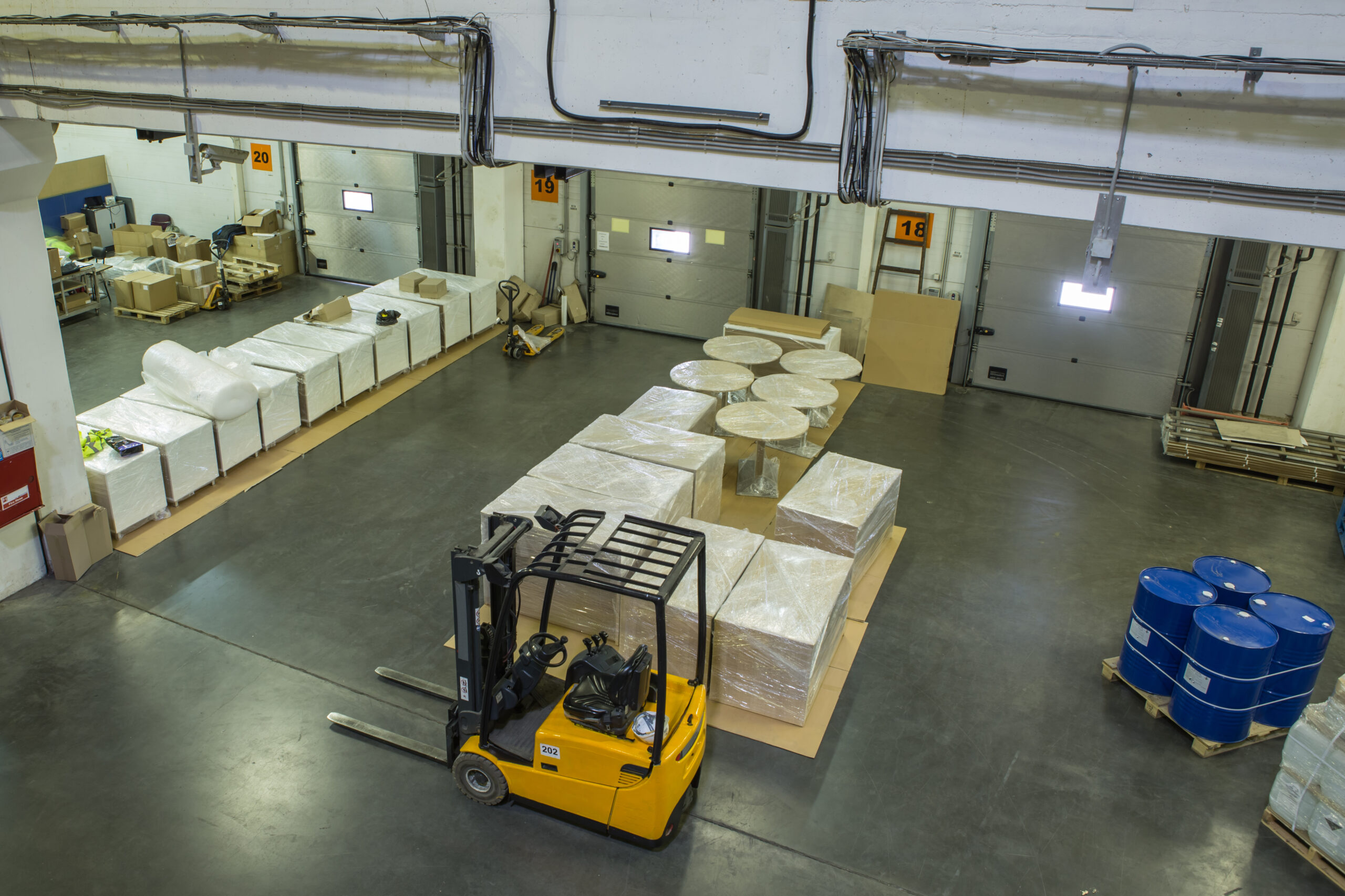 Interior of modern warehouse with closed gates